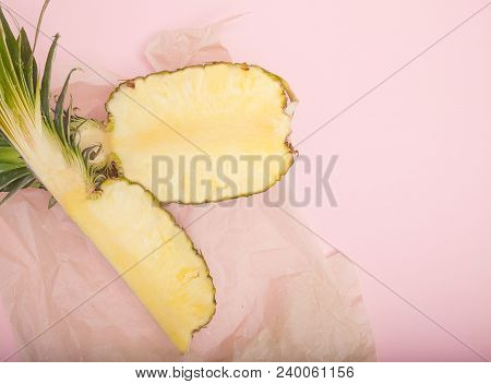 Half Cut Juicy Pineapple On A Pastel Pink Background. Minimal Summer Concept.