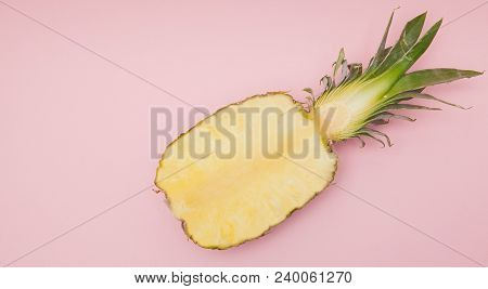 Half Cut Juicy Pineapple On A Pastel Pink Background. Minimal Summer Concept.