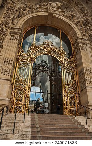 Paris, Northern France - July 11, 2017. Close-up Of The Far-fetched Golden Gate And Arch On Top Of S