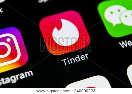 Sankt-petersburg, Russia, May 10, 2018: Tinder Application Icon On Apple Iphone X Screen Close-up. T