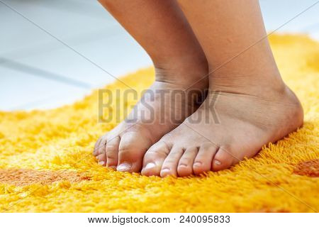 Little Girl Showing Her Dirty Feet In The Bathroom