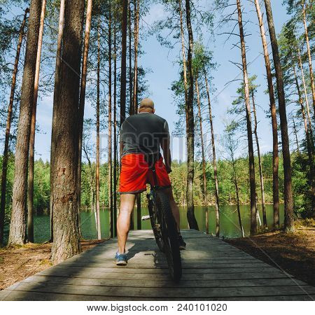 Ciclist In The Beautiful Place For Riding Around The Magic Forest Lake