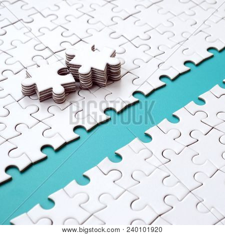 The Blue Path Is Laid On The Platform Of A White Folded Jigsaw Puzzle. The Missing Elements Of The P