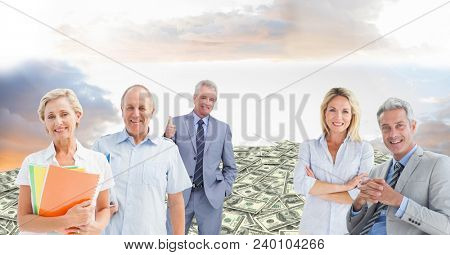Old business people on hill of money