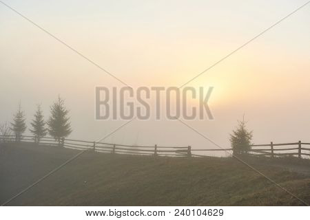 Foggy Morning In The Ukrainian Carpathian Mountains In The Autumn Season.