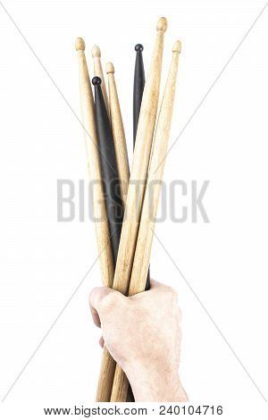 A Lot Of Drumsticks Of Two Colors In A Hand, Isolated On A White Background
