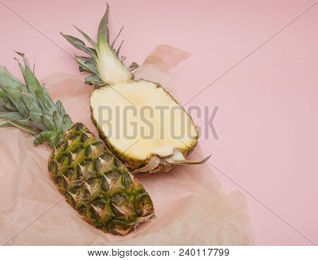 Half Cut Juicy Pineapple On A Pastel Pink Background. Minimal Summer Concept.