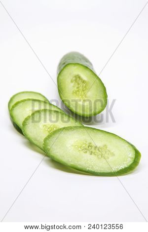 Cucumber Chopped Ovals On A White Background , Beauty And Health