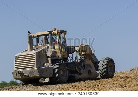 Construction Machine - The Vehicle At Work On Construction Site