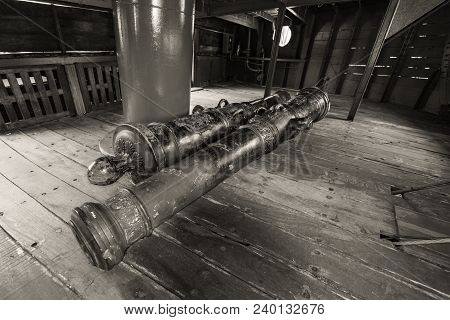 Genoa, Italy - May 14, 2017: Iron Cannons On The Deck Of The Galleon Neptun Old Wooden Ship In Porto