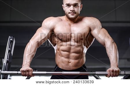 Brutal Strong Bodybuilder Athletic Men Pumping Up Muscles With Dumbbells