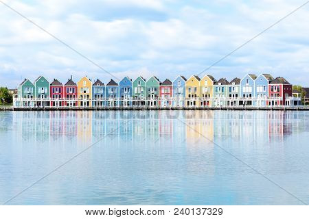 Vivid Dutch Wooden Houses Village On Canal On Sunny Day