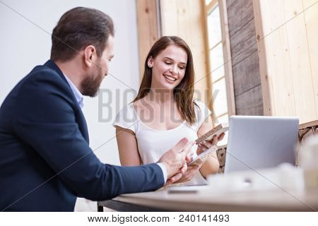 Appropriate Surface. Low Angle Of Ambitious Two Designers Selecting Wood While Talking
