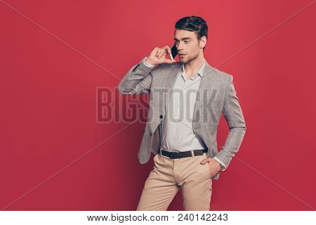 Portrait Of Half Turned Stunning, Modern, Virile, Harsh Man Holding Hand In Pocket Of Pants, Having 