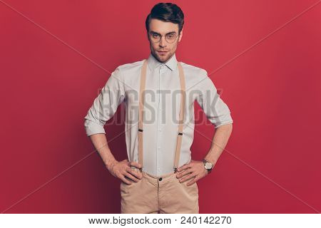 Portrait Of Virile, Harsh Modern Fashion Expert In Glasses, Holding Two Hands On Waist, Looking At C