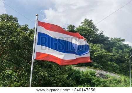 Picture Of Waving Thai Flag Of Thailand With Blue Sky Background., King Bhumipol