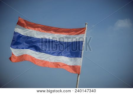 Picture Of Waving Thai Flag Of Thailand With Blue Sky Background., King Bhumipol
