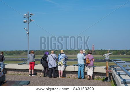 Berlin Germany - April 21. 2018: Berlin Germany - April 21. 2018: Airplane Spotters Looking At Airpl