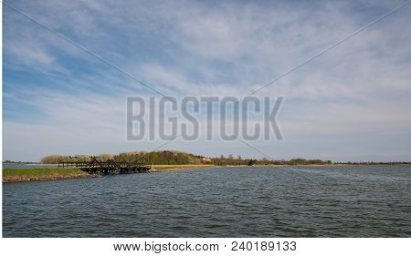 Dam And Bridge Towards Island Of Langoe In Denmark