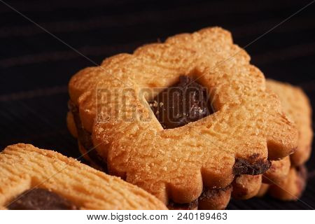 Chocolate Cookies On Gray Plate On Black Wooden Table