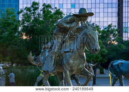 Dallas, Texas - May 7, 2018: View Of Cowboy And Longhorn Cows With Cattle In The Background, As Part