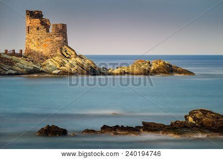 Erbalunga Tower And Harbour With Rocks On Foreground, Corsica, France