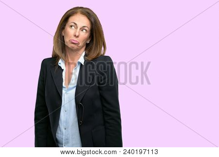 Middle age business woman having skeptical and dissatisfied look expressing Distrust, skepticism and doubt
