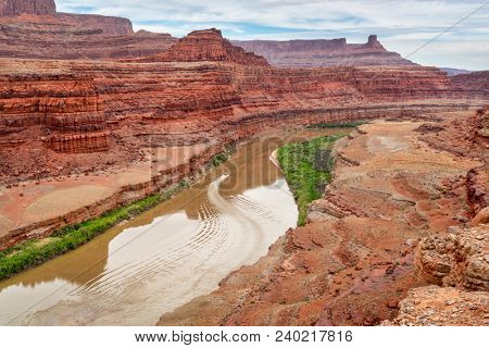 A jetboat transporting kayaks upstream of Colorado River below Moab in Utah