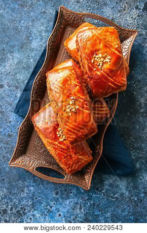 Traditional Turkish Pastry Roll With Chocolate And Nuts Filling - Pastich Served On A Vintage Tray.