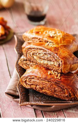 Traditional Turkish Pastry Roll With Chocolate And Nuts Filling - Pastich Served On A Vintage Tray.