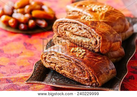 Traditional Turkish Pastry Roll With Chocolate And Nuts Filling - Pastich Served On A Vintage Tray.