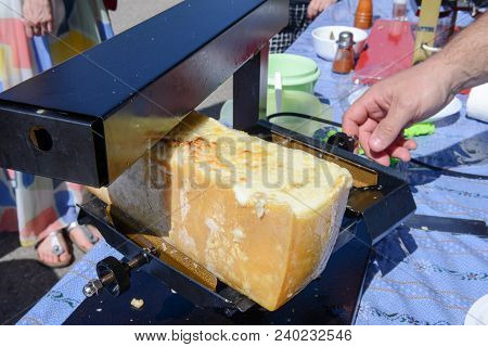 Preparation Of Raclette At Mugena On The Swiss Alps