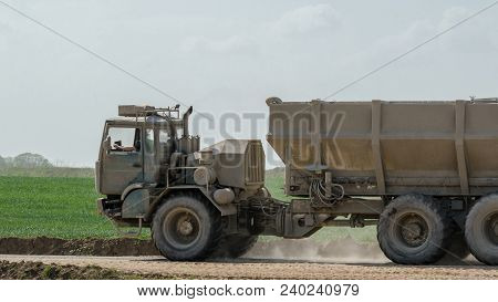 Truck - The Vehicle At Work On Construction Site
