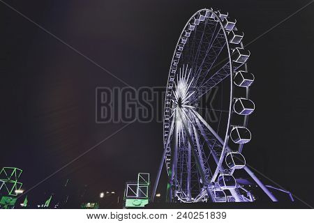 Part Of Ferris Wheel In City At Night.