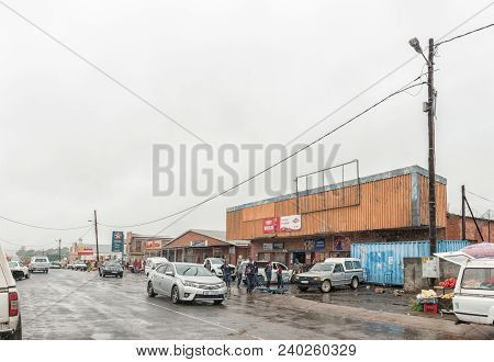 Pomeroy, South Africa - March 22, 2018: A Street Scene With Businesses, Vehicles And People In Pomer