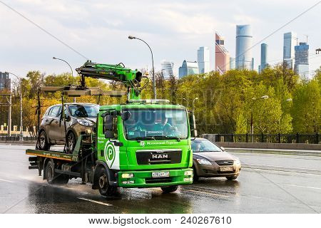 Moscow, Russia - May 2, 2018: Green Rescue Service Truck Man Tgl In The City Street At The Backgroun