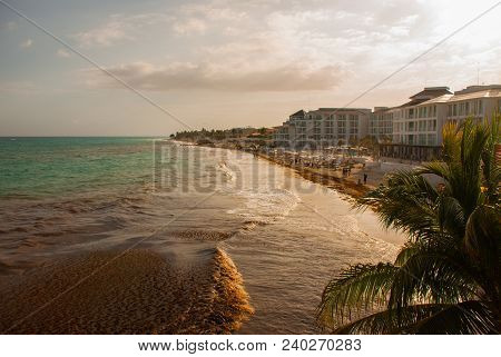 Playa Del Carmen, Mexico Showing Luxury Resorts And Blue Turquoise Beach During Sunrise.