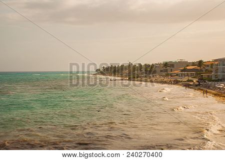 Playa Del Carmen, Mexico Showing Luxury Resorts And Blue Turquoise Beach During Sunrise.