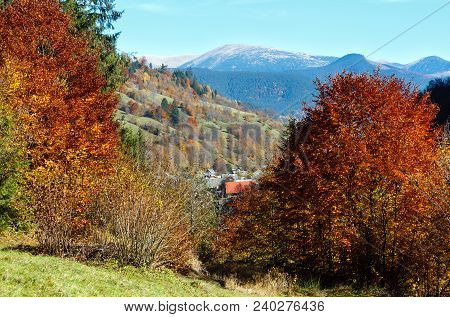 Autumn Carpathian Mountains Landscape With Multicolored Yellow-orange-red-brown Trees On Slope And W