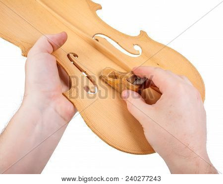 Luthier Showing The Usage Of Small Hand Plane