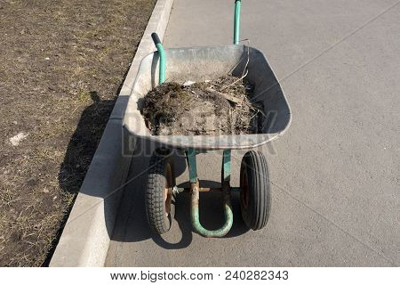 Wheelbarrow With Garbage, Cleaning Of The Territory