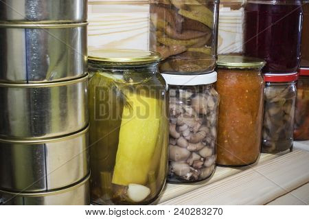 Storage Shelves In Pantry With Homemade Canned Preserved Fruits And Vegetables.