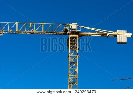 Lots Of Tower Construction Site With Cranes And Building With Blue Sky Background
