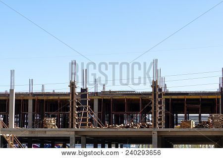 Lots Of Tower Construction Site With Cranes And Building With Blue Sky Background