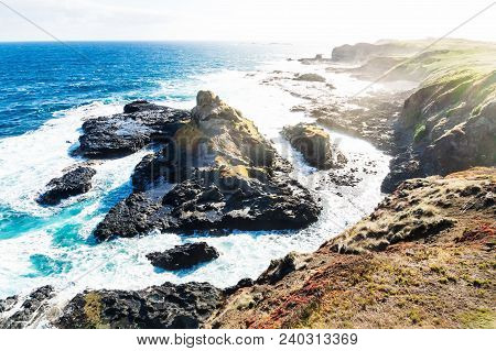 View From Southpoint Lookout To Volcanic Rock In The Ocean With Strong Waves At The Nobbies, Phillip