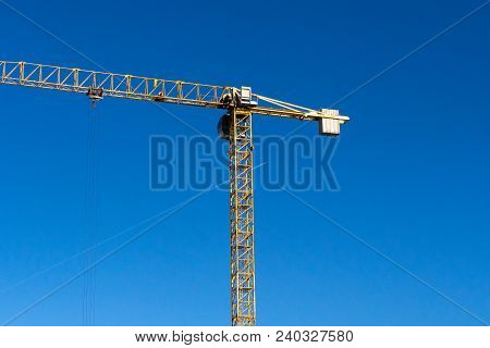 Lots Of Tower Construction Site With Cranes And Building With Blue Sky Background