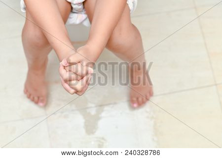 Child Unhappy Sitting In Toilet, Diarrhea Constipation. Health And Cleanliness Concept