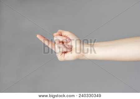 Woman Hand Showing Middle Finger On A White Isolated Background