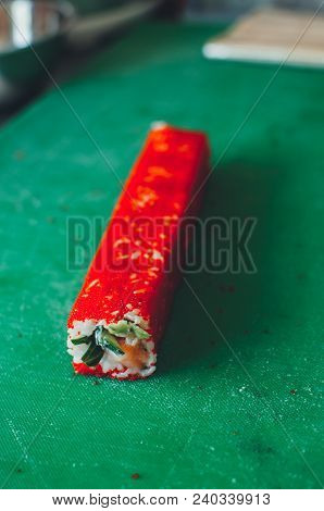 Professional Chef, Chef The Process Of Making Sushi Rolls, Spins Bamboo Mat And Cut Slices