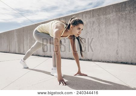 Zealous Young Girl Athlete Prepared To Run A Marathon, Stands At The Start, Outdoors